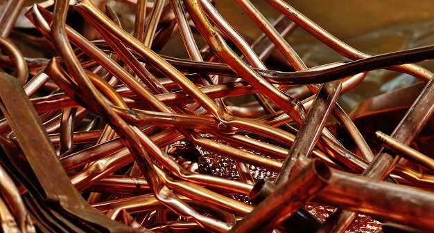 A messy pile of scrap copper pipes